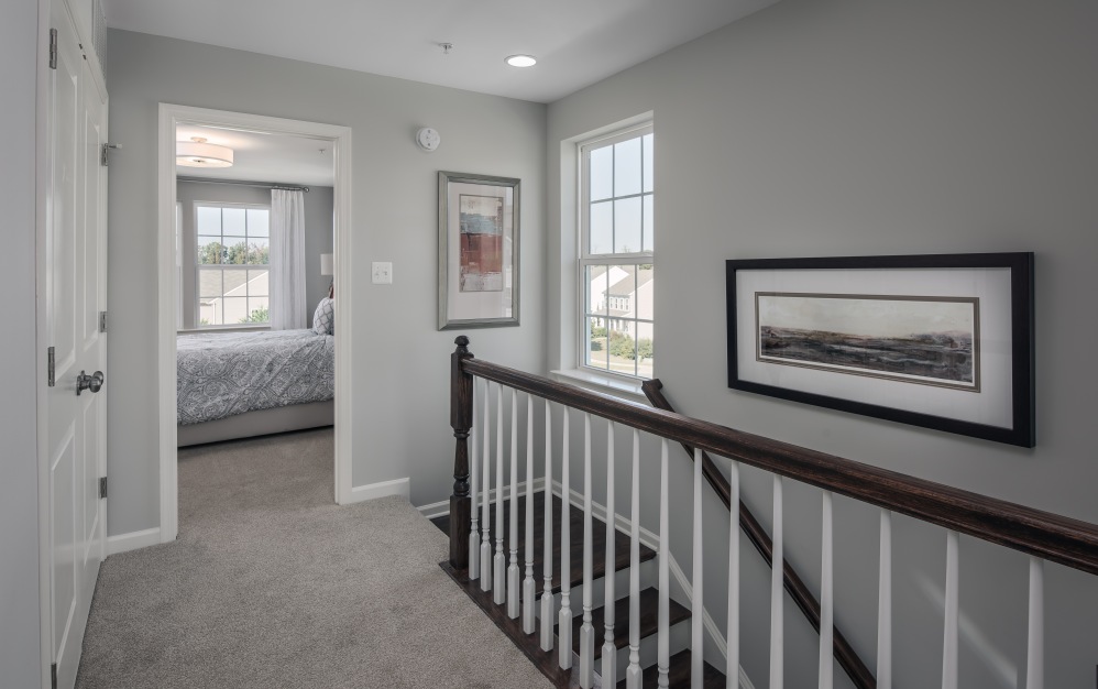Explore the Hartland at Brookestone in Waldorf, MD: a 2,200 sq. ft. townhome for rent with 3 bedrooms, 2.5 baths, a modern kitchen, and an attached garage.